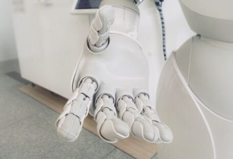 Ai - closeup photo of white robot arm