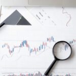 Trading Analysis - Magnifying Glass on Top of Document